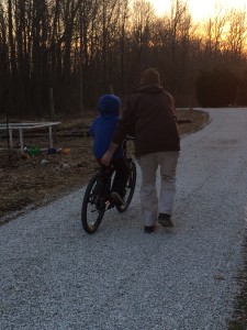 Kevin teaching our youngest son to ride!