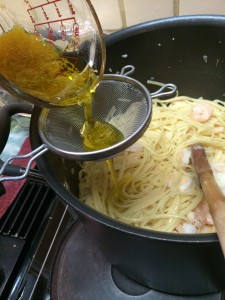 straining lemon olive oil